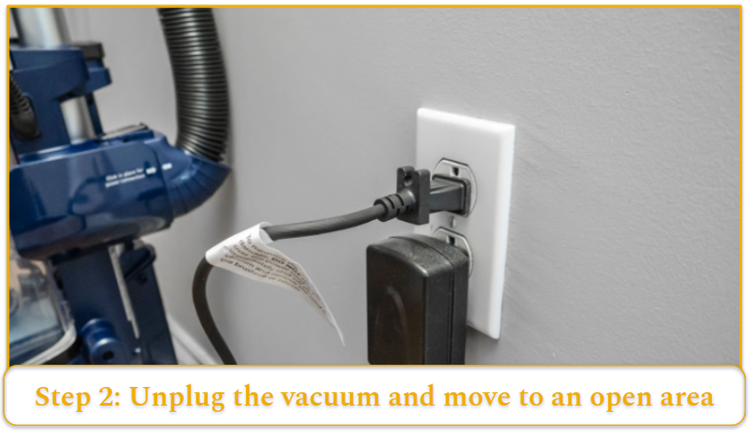 Vacuum cleaner plugged into a wall outlet