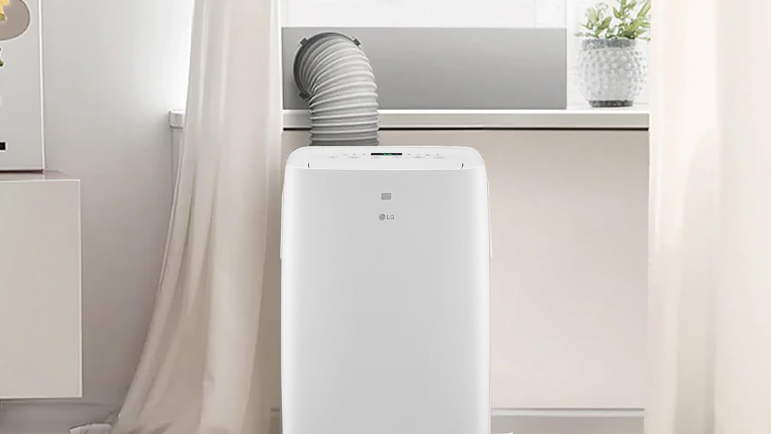 An LG portable air conditioner installed in front of a window