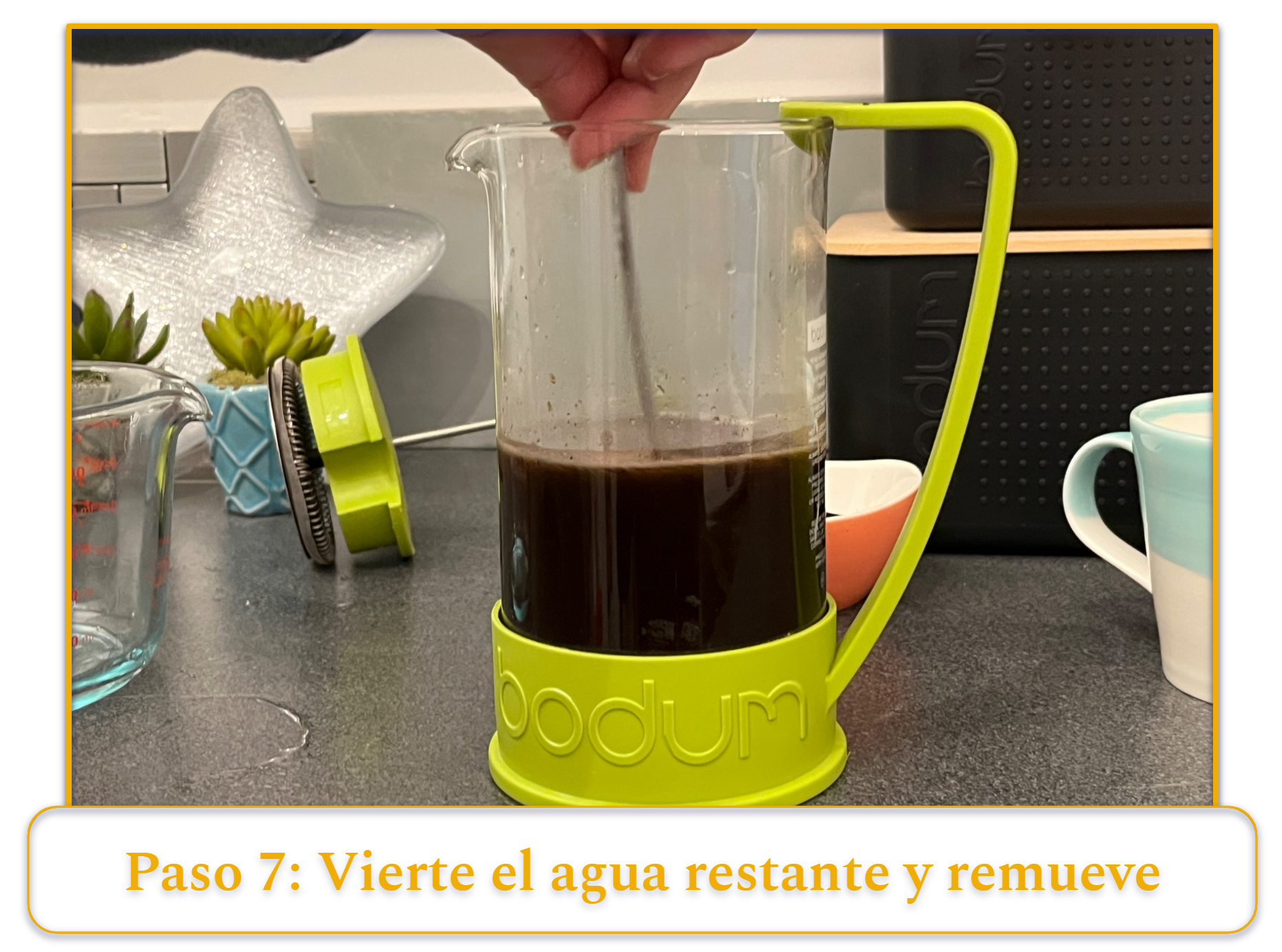 step 7 of making french press coffee; pouring in the rest of the water and stirring