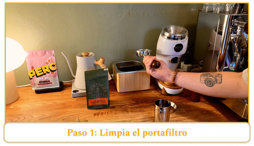 step 1 of using an espresso machine; clean the portafilter