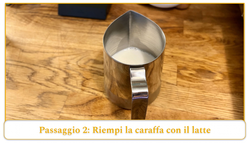 step 2 of using an espresso machine's steam wand; fill the pitcher with milk