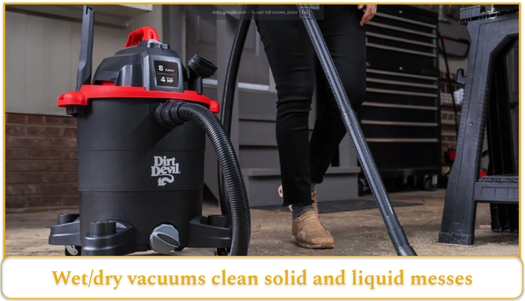 Person using a wet/dry vacuum to clean the garage.