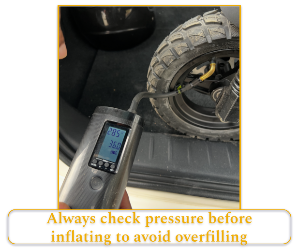 Digital pressure gauge checking tire pressure on an electric scooter